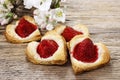 Puff pastry cookies in heart shape filled with strawberries Royalty Free Stock Photo