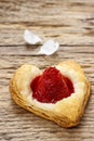 Puff pastry cookies in heart shape filled with strawberries Royalty Free Stock Photo