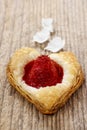 Puff pastry cookies in heart shape filled with strawberries. Royalty Free Stock Photo