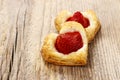 Puff pastry cookies in heart shape filled with strawberries. Royalty Free Stock Photo