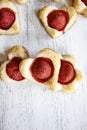 Puff pastry cookies in heart shape filled with strawberries Royalty Free Stock Photo