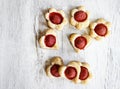 Puff pastry cookies in heart shape filled with strawberries Royalty Free Stock Photo