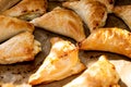 Puff pastry with cottage cheese. Puff pastry triangles with feta cheese on a protvin on a table