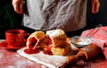 Puff pastry dessert red jam viburnum cherry cup coffee black background