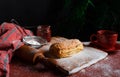 Puff pastry dessert red jam viburnum cherry cup coffee black background