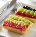 Puff pastry filled with strawberry, banana and kiwi fruit Royalty Free Stock Photo