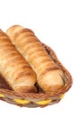 Puff pastry with a hot dog in a wicker basket Royalty Free Stock Photo