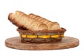 Puff pastry with a hot dog in a wicker basket Royalty Free Stock Photo