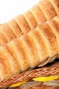 Puff pastry with a hot dog in a wicker basket Royalty Free Stock Photo
