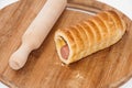 Puff pastry with a hot dog on the wooden board Royalty Free Stock Photo
