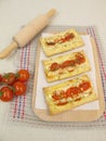 Puff pastry pizza with tomato and cheese Royalty Free Stock Photo