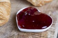 puff pastry with red strawberry jam on a wooden table Royalty Free Stock Photo