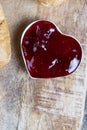 puff pastry with red strawberry jam on a wooden table Royalty Free Stock Photo