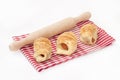 Puff pastry and rolling pin on the table cloth Royalty Free Stock Photo