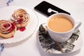 Puff pastry on a table with a cup of coffee Royalty Free Stock Photo