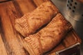 Puff pastry with toppings. Puffs with cheese on a wooden tray. Royalty Free Stock Photo