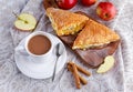 Puff pastry Turnovers apple cake dessert with whipped cream and hot coffee. Royalty Free Stock Photo