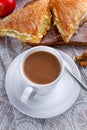 Puff pastry Turnovers apple cake dessert with whipped cream and hot coffee. Royalty Free Stock Photo