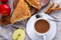 Puff pastry Turnovers apple cake dessert with whipped cream and hot coffee. Royalty Free Stock Photo