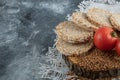 Puffed crispbread, tomatoes and raw buckwheat on marble surface