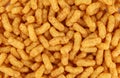 Puffed peanuts and corn snacks. Full frame. Royalty Free Stock Photo