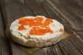 Rice crackers with smoked salmon spread on old wooden surface Royalty Free Stock Photo