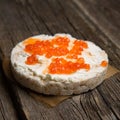 Rice crackers with smoked salmon spread on old wooden surface Royalty Free Stock Photo