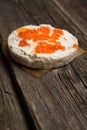 Rice crackers with smoked salmon spread on old wooden surface Royalty Free Stock Photo