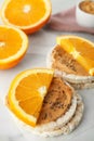 Puffed rice cakes with peanut butter and orange on table Royalty Free Stock Photo