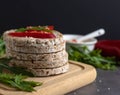 Puffed rice crackers on wooden board with pepper slices. Royalty Free Stock Photo