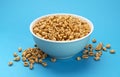 Puffed wheat cereal isolated on blue background Royalty Free Stock Photo