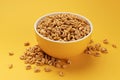 Puffed wheat cereal isolated on yellow background Royalty Free Stock Photo