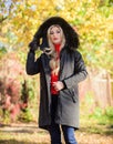 Puffer jacket with hood. Woman wear black parka fur hood. Classic parka coat has become wardrobe icon. Versatile