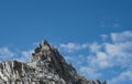 Puffs of Clouds Pass Ragged Peak in Yosemite