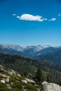 Puffy Cloud In Bright Blue Sky Hangs Over the High Sierras Royalty Free Stock Photo