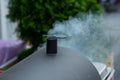 Puffy smoke from charcoal chimney starter Royalty Free Stock Photo
