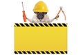 Pug dog holding pliers and screwdriver behind yellow warning sign Royalty Free Stock Photo