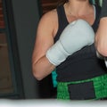 Pugilist Girl at Boxing Training in the Ring with Sparring Partner