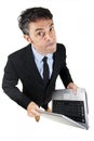 Pugnacious businessman holding a laptop