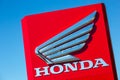 Honda company name with logo on red wall Royalty Free Stock Photo