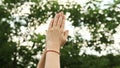 Puja. Women's hands are praying in the forest