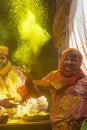 Pujari Splashing colours in Temple at barsana during Holi Festival,UttarPradesh,India Royalty Free Stock Photo