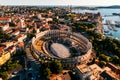 Pula Arena at sunset - HDR aerial view taken by a professional drone. The Roman Amphitheater of Pula