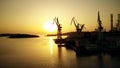 PULA, CROATIA - AUGUST 5, 2017. Aerial view of the Uljanik shipyard cranes silhouettes at sunset Royalty Free Stock Photo