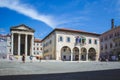 Pula, Croatia - July 16 2018: The ancient roman Temple of Augustus next to the Communal Palace city hall in the city of Pula