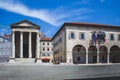 Pula, Croatia - July 16 2018: The ancient roman Temple of Augustus next to the Communal Palace city hall in the city of Pula