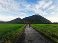 Pulai Mountain, Baling, Kedah, Malaysia - 26 December 2020 - scenery of Pulai Mountain while jogging alongside paddy field Royalty Free Stock Photo