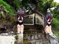 Access stairs to a catholic mausoleum with two sculptures on Lake Toba, Pulau Samosir. Indonesia