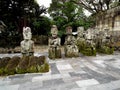 Ancient sculptures of kings made of stone in a cemetery of Lake Toba, Pulau Samosir. Indonesia