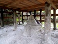 Stone grave under a house of an ancient megalithic settlement on Lake Toba, Pulau Samosir. Indonesia